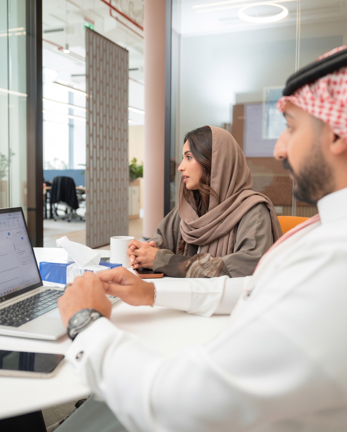 Professionals in a discussion at a modern office